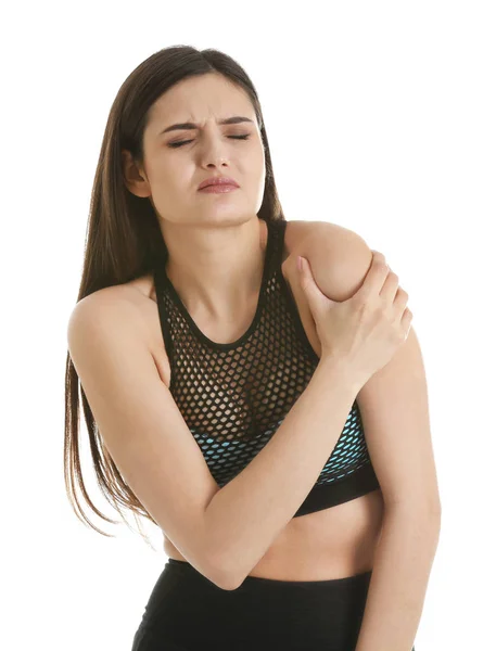 Young woman suffering from shoulder pain on white background — Stock Photo, Image