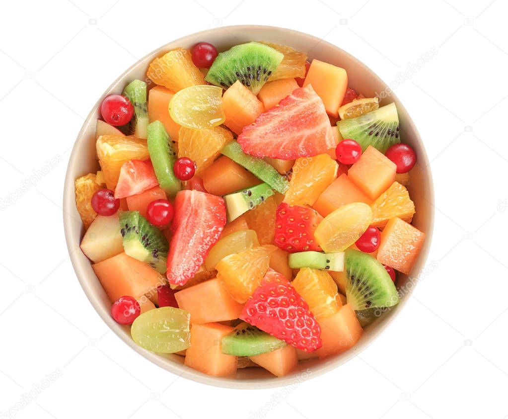 Bowl with fresh cut fruits on white background