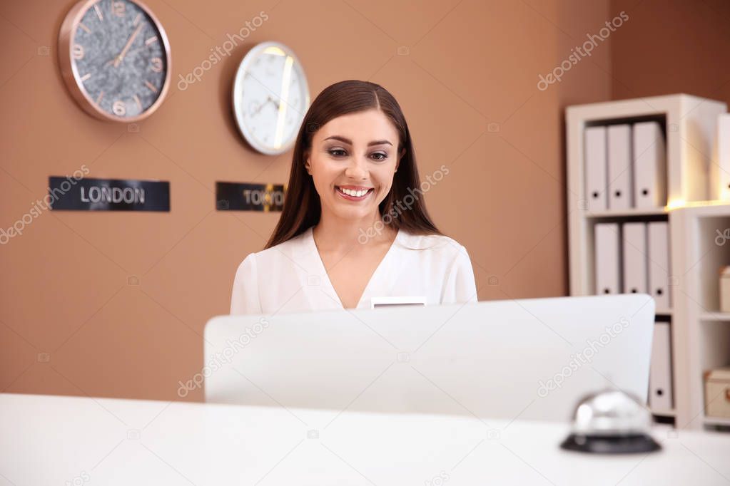Female receptionist at hotel check-in counter