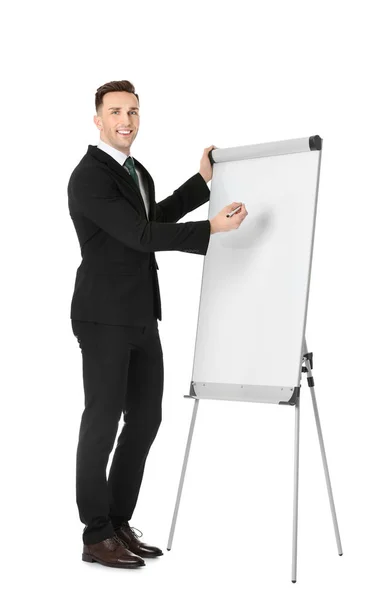 Молодой бизнес-тренер возле флип-чарта на белом фоне — стоковое фото