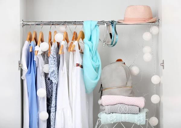 Women clothing on hangers in wardrobe — Stock Photo, Image