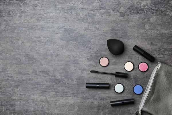 Decorative makeup products on grey background — Stock Photo, Image