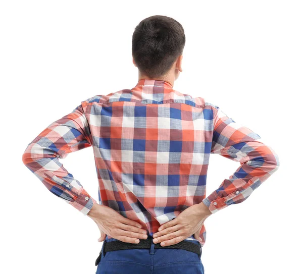 Jovem sofrendo de dor nas costas no fundo branco — Fotografia de Stock