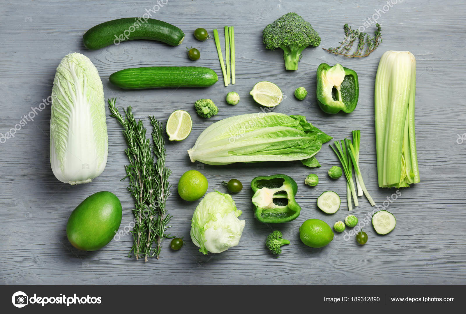 Flat lay composition with green vegetables and fruits on 