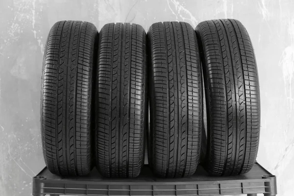 Car tires on grey background — Stock Photo, Image