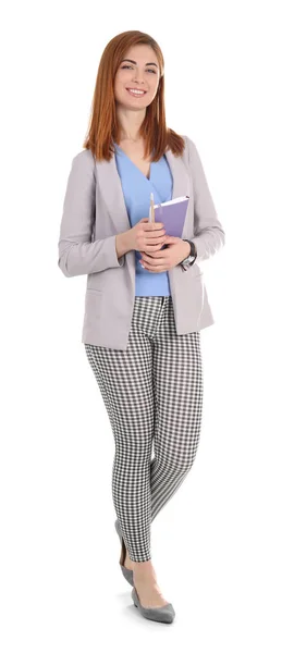 Hermosa maestra joven con cuaderno sobre fondo blanco — Foto de Stock