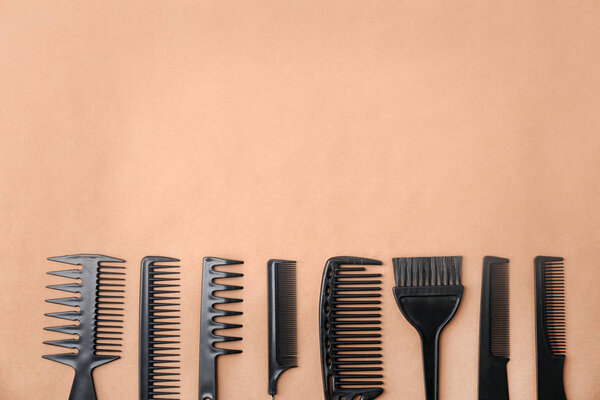 Flat lay composition with professional hairdresser tools on color background