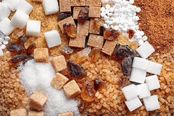 Different types of sugar as background
