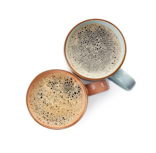Cups with delicious hot coffee on white background — Stok Foto