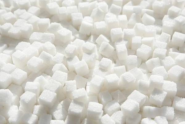 Cubos de açúcar refinado como fundo — Fotografia de Stock