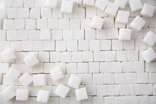 Rafinovaný cukr kostky jako pozadí, pohled shora — Stock fotografie