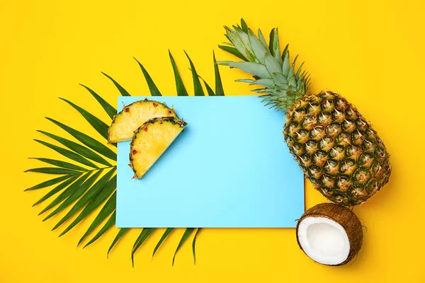 Fresh pineapples and coconut on color background, flat lay — Stock Photo, Image