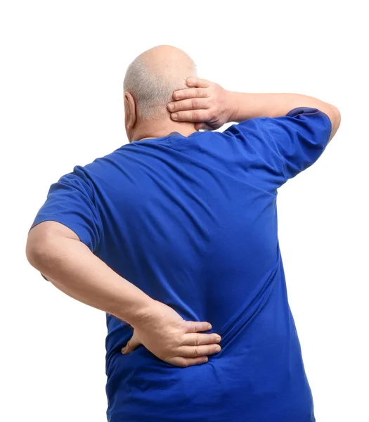 Senior man suffering from pain in back on white background — Stock Photo, Image