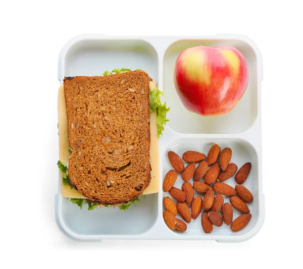 Scatola da pranzo con cibo appetitoso su sfondo bianco, vista dall'alto — Foto Stock