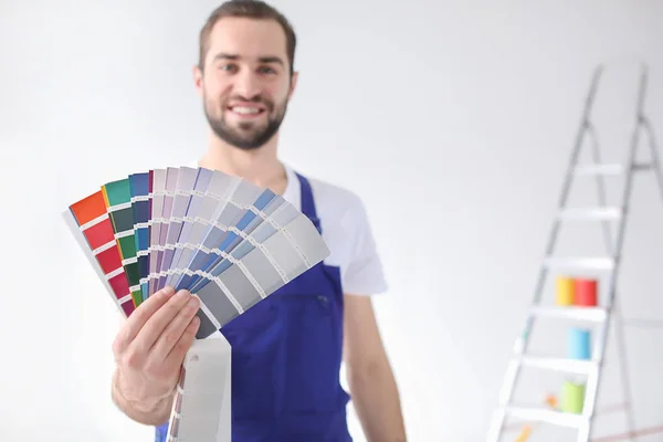 Male decorator with color palette on white background — Stock Photo, Image