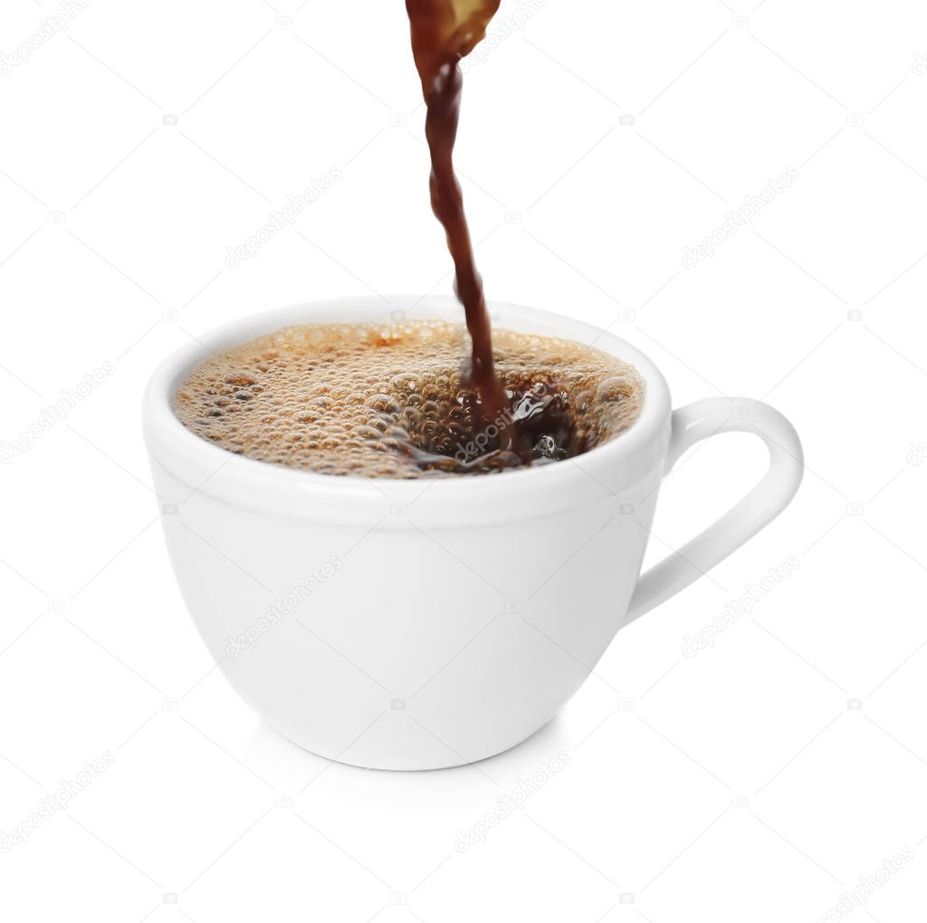 Pouring aromatic hot coffee into cup on white background