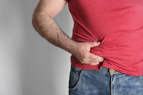 Overweight man on white background