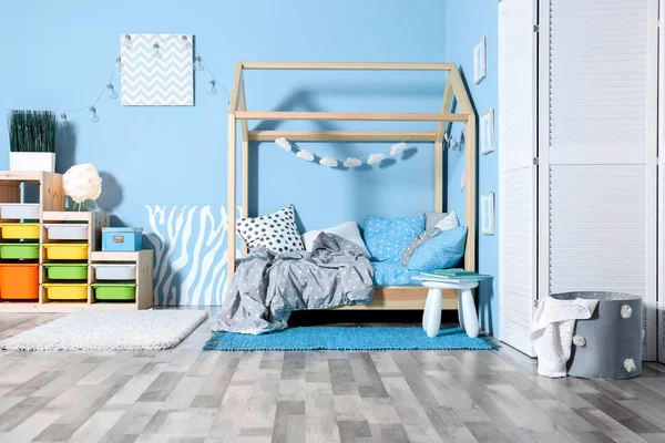 Comfortable bed in modern children room — Stock Photo, Image