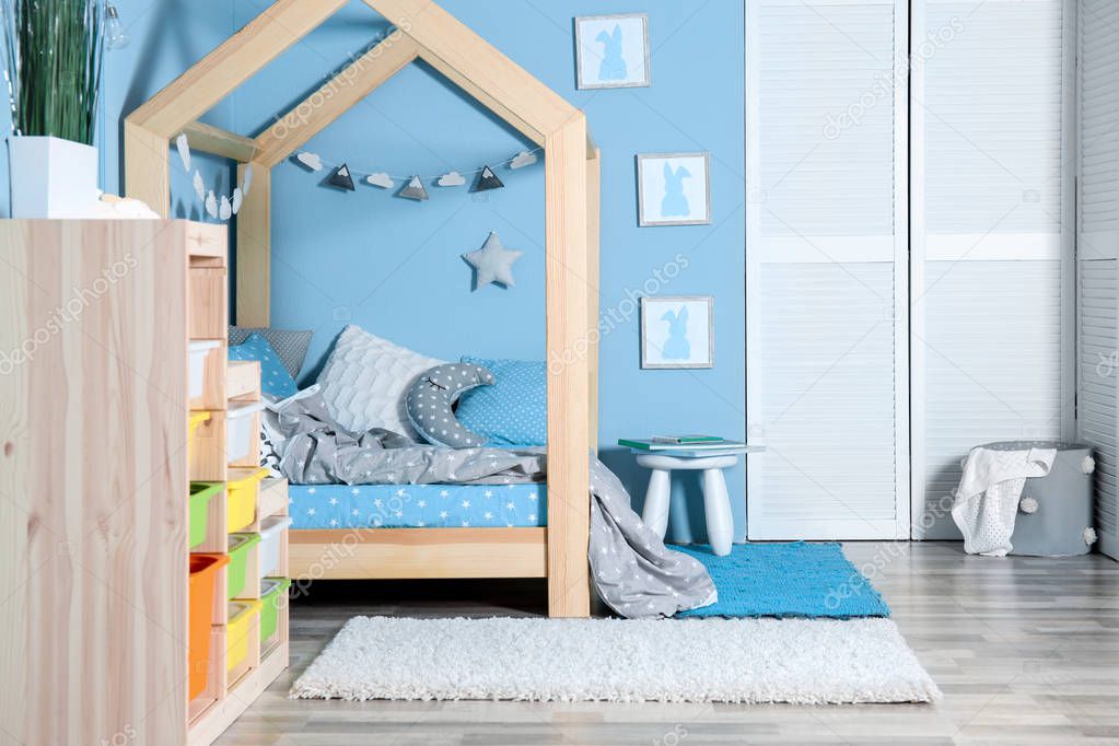 Comfortable bed in modern children room