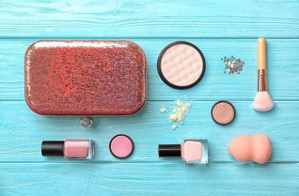 Flat lay composition with cosmetic products on wooden background