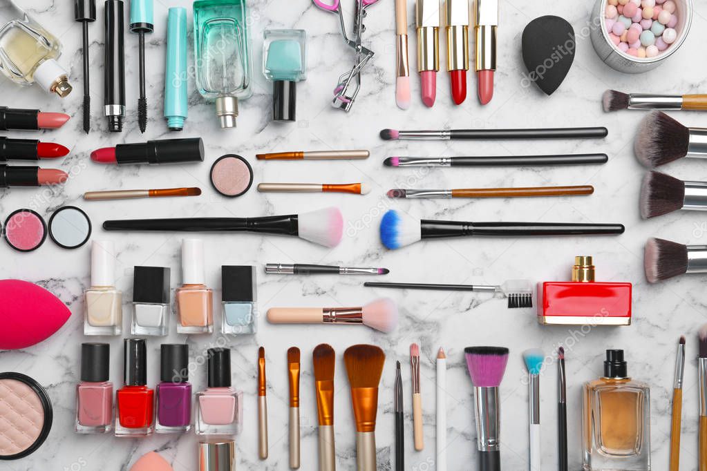 Flat lay composition with cosmetic products on marble background