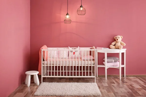 Modern baby room interior with crib — Stock Photo, Image