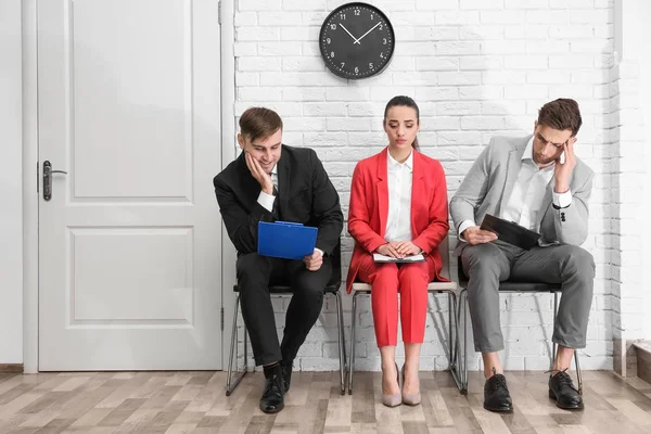 Group of people waiting for job interview, indoors