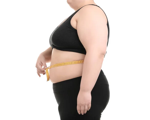 흰 배경에 줄자 가 있는 체중 과다인 여자 — 스톡 사진