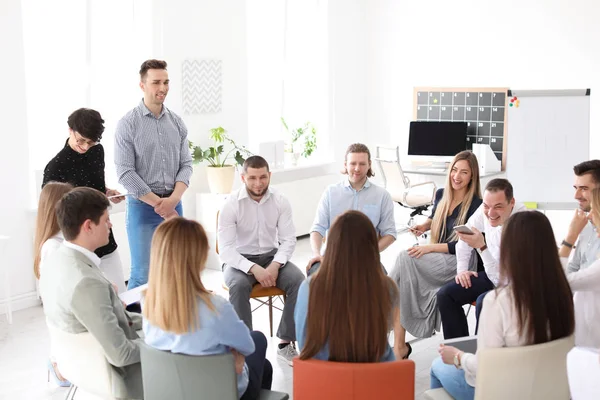 Young people having business training in office