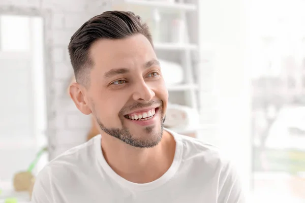 Young man with beautiful smile indoors. Teeth whitening — Stock Photo, Image