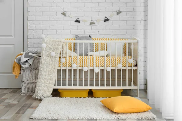 Stylish baby room interior with crib — Stock Photo, Image