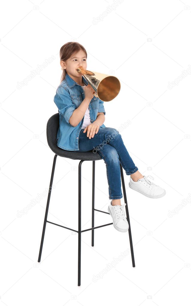 Adorable little girl with vintage megaphone on white background