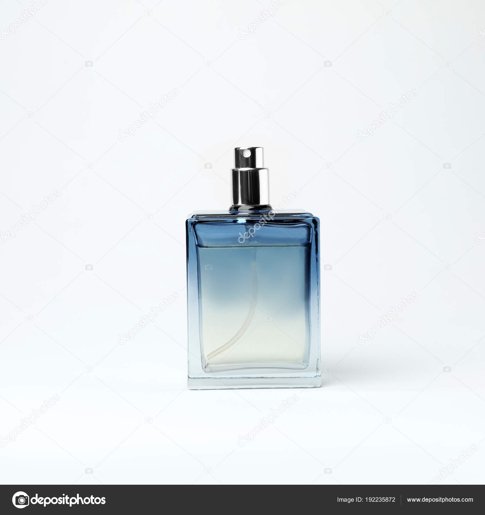 Transparent bottle of perfume on white background — Stock Photo