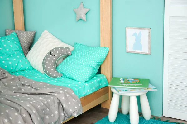 Comfortable bed in modern children room — Stock Photo, Image