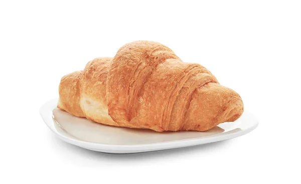 Piatto con gustoso croissant su sfondo bianco — Foto Stock