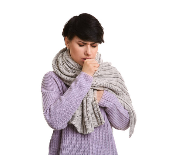 Young woman coughing on white background