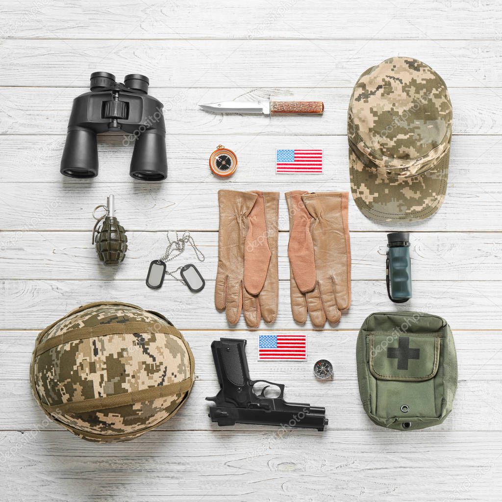 Set of military equipment on wooden background, flat lay