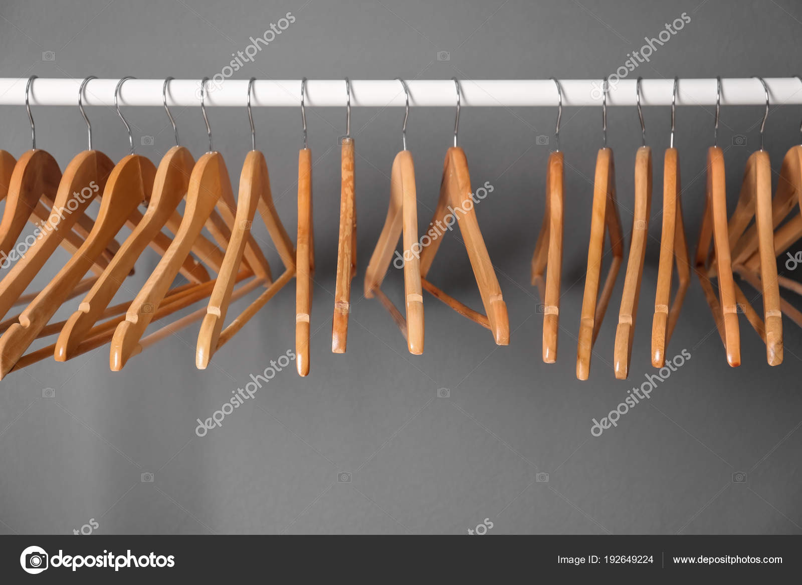 gray wooden hangers