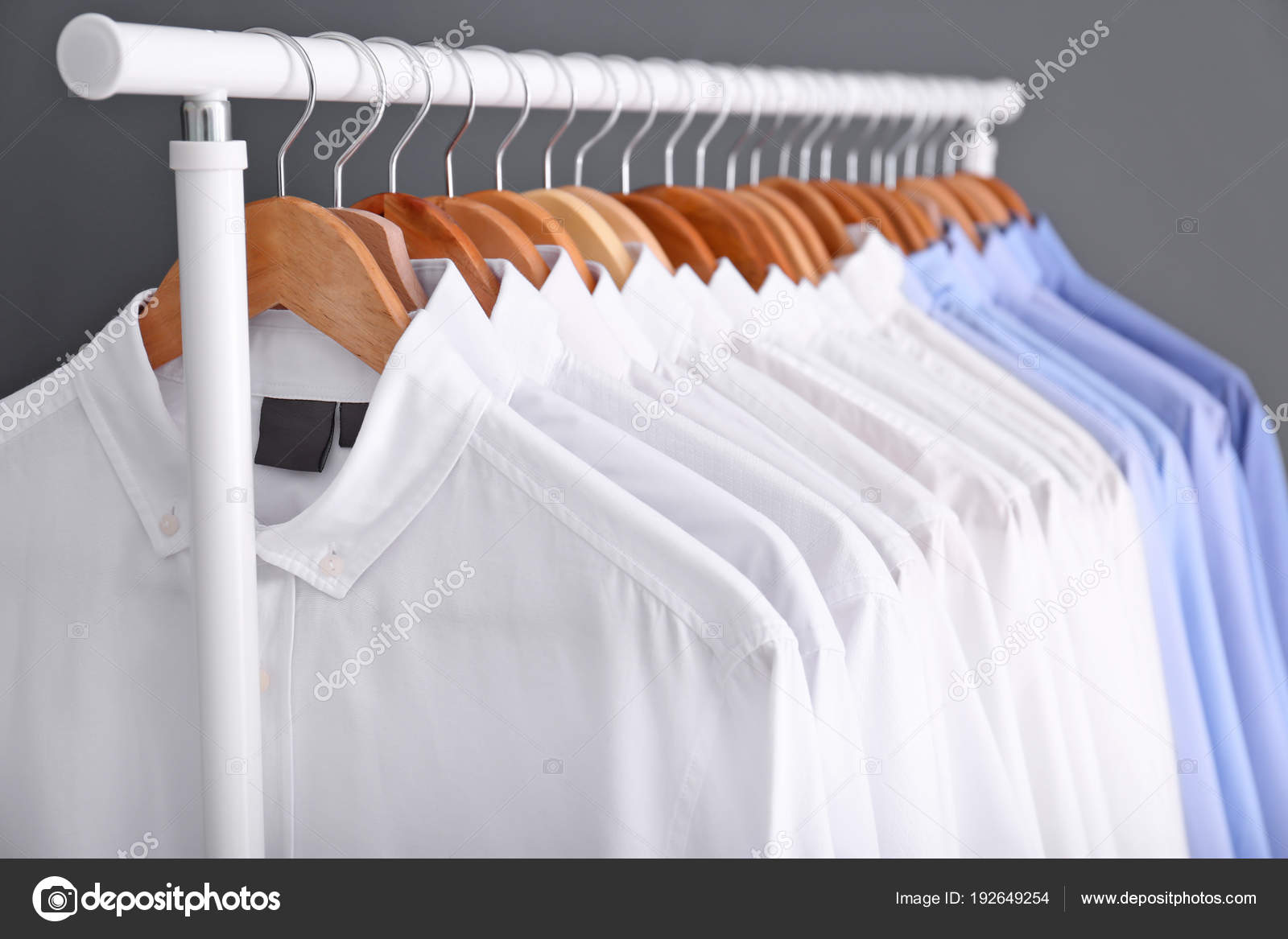Rack with clean clothes on hangers after dry-cleaning Stock Photo by  ©NewAfrica 192649254