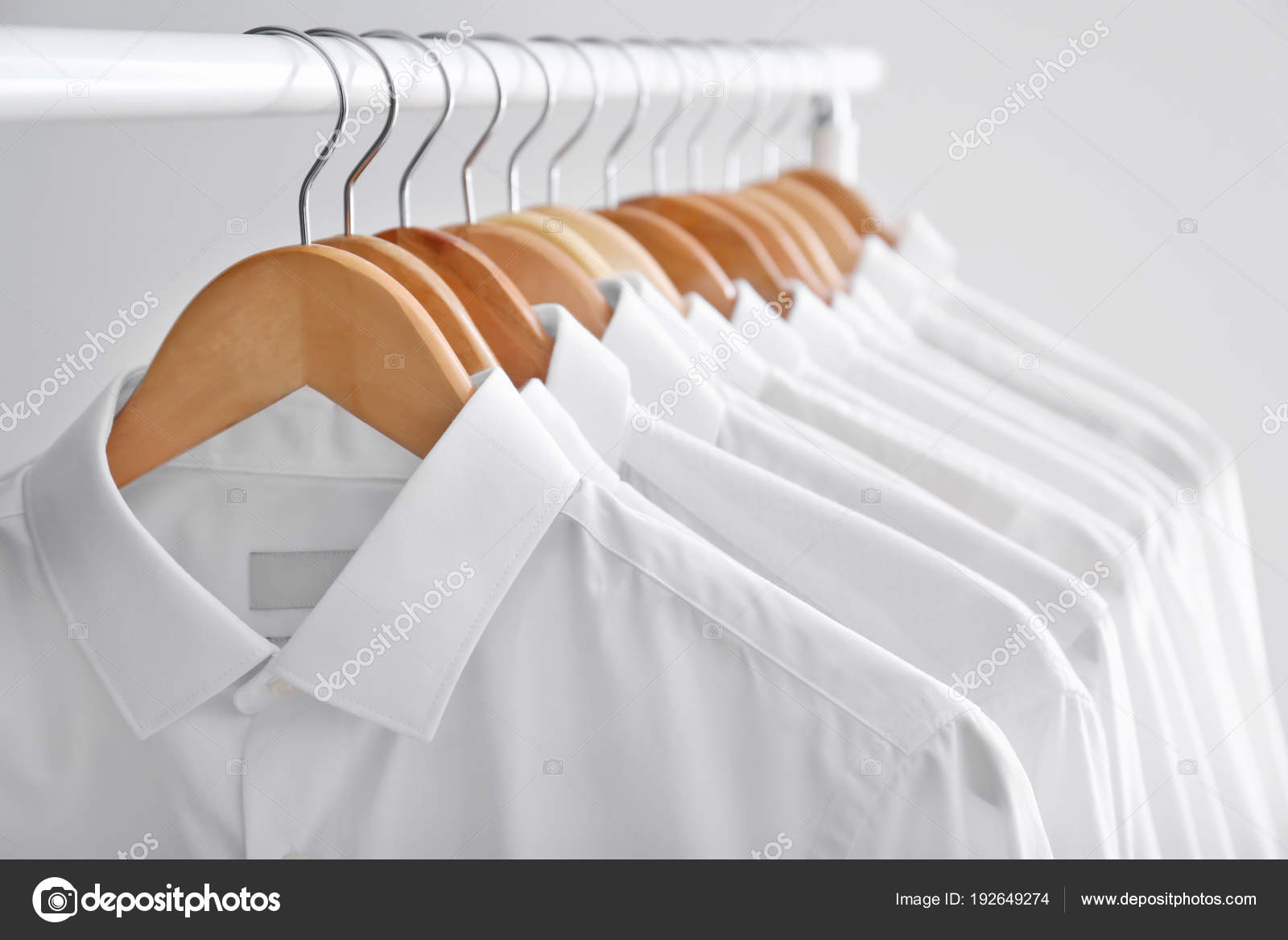 Rack with clean clothes on hangers after dry-cleaning Stock Photo by  ©NewAfrica 192649274
