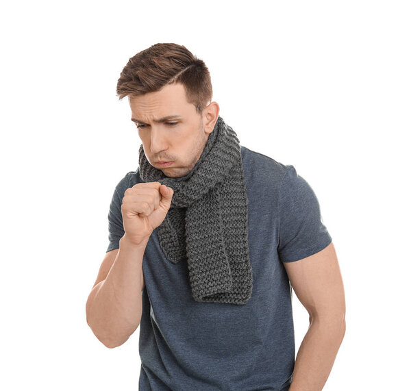 Young man coughing on white background