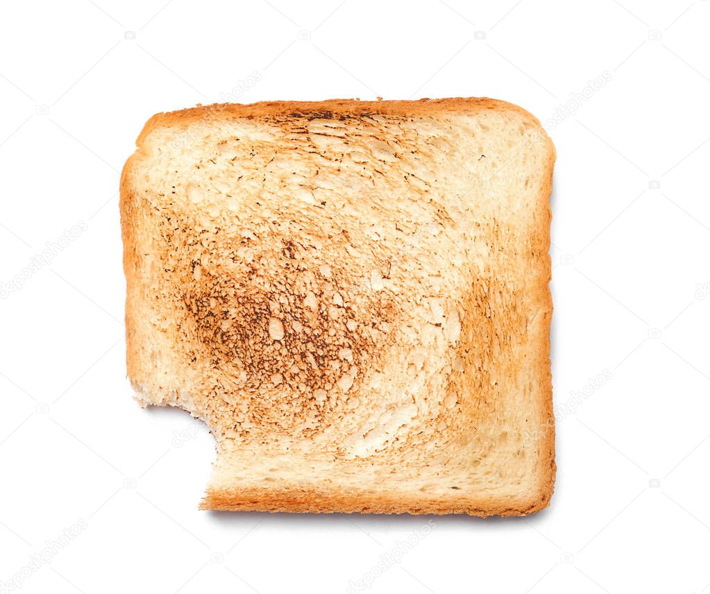 Toasted bread with bite mark on white background, top view