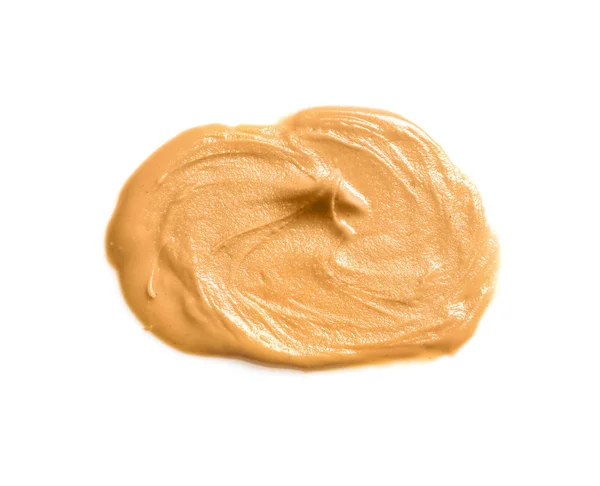 Cremige Erdnussbutter auf weißem Hintergrund — Stockfoto