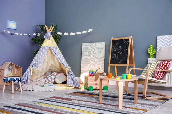 Modern room interior with play tent for child