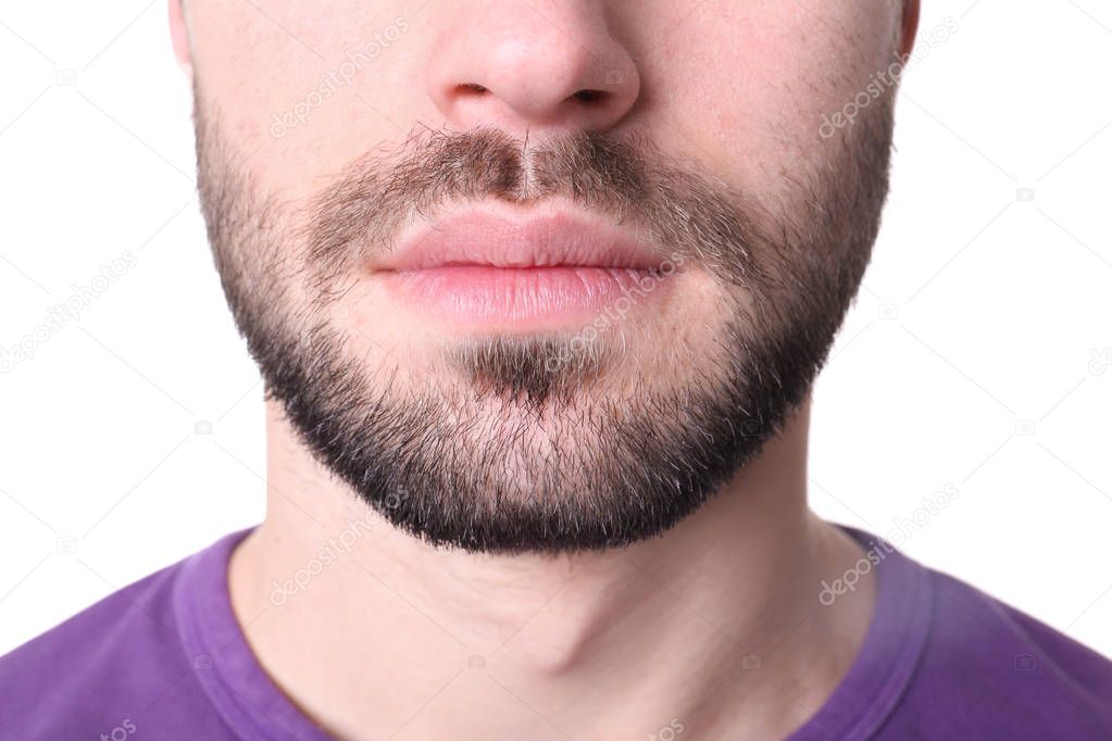 Young man on white background, closeup. Focus on lips