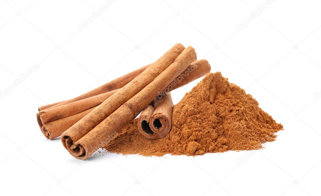 Aromatic cinnamon sticks and powder on white background