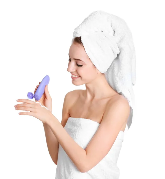 Young woman applying hand cream on white background — Stock Photo, Image