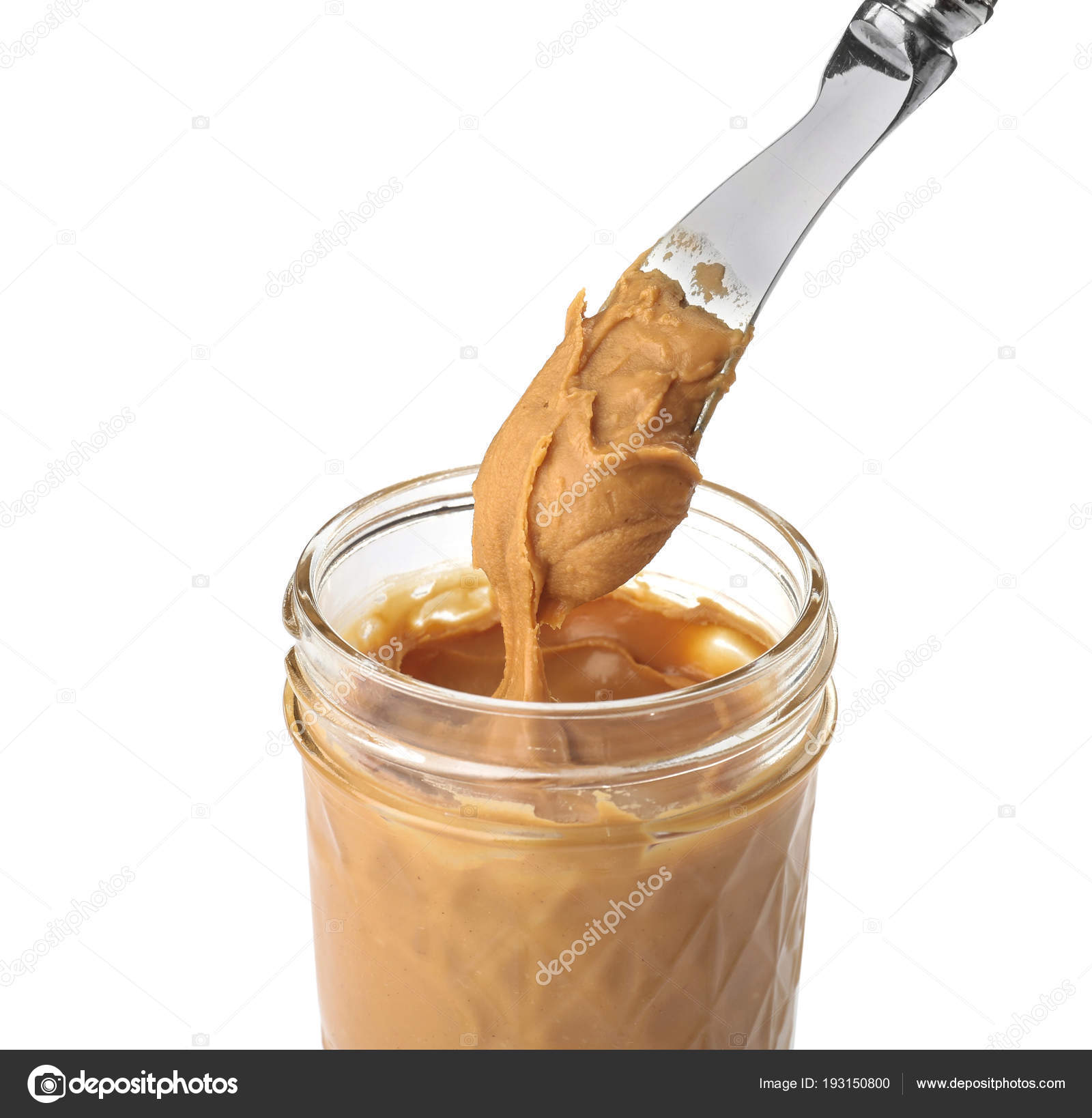 Jar and knife with creamy peanut butter on white background Stock Photo by  ©NewAfrica 193150800