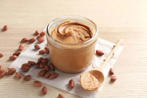 Jar with peanut butter and knife butter smear isolated on white background.  Ameriacan dessert concept Stock Photo - Alamy