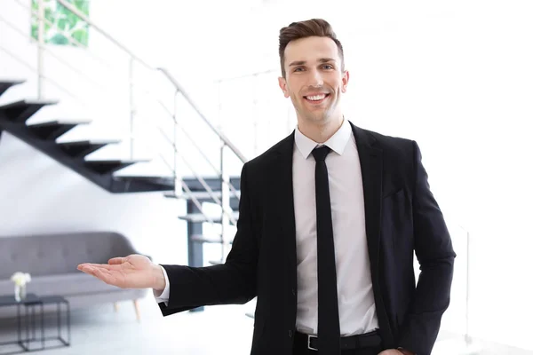 Male real estate agent indoors — Stock Photo, Image